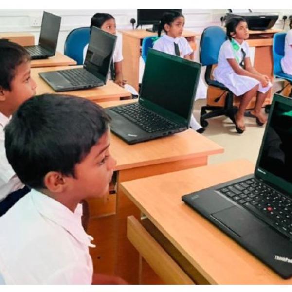 Students at Uyana Primary School using donated laptops